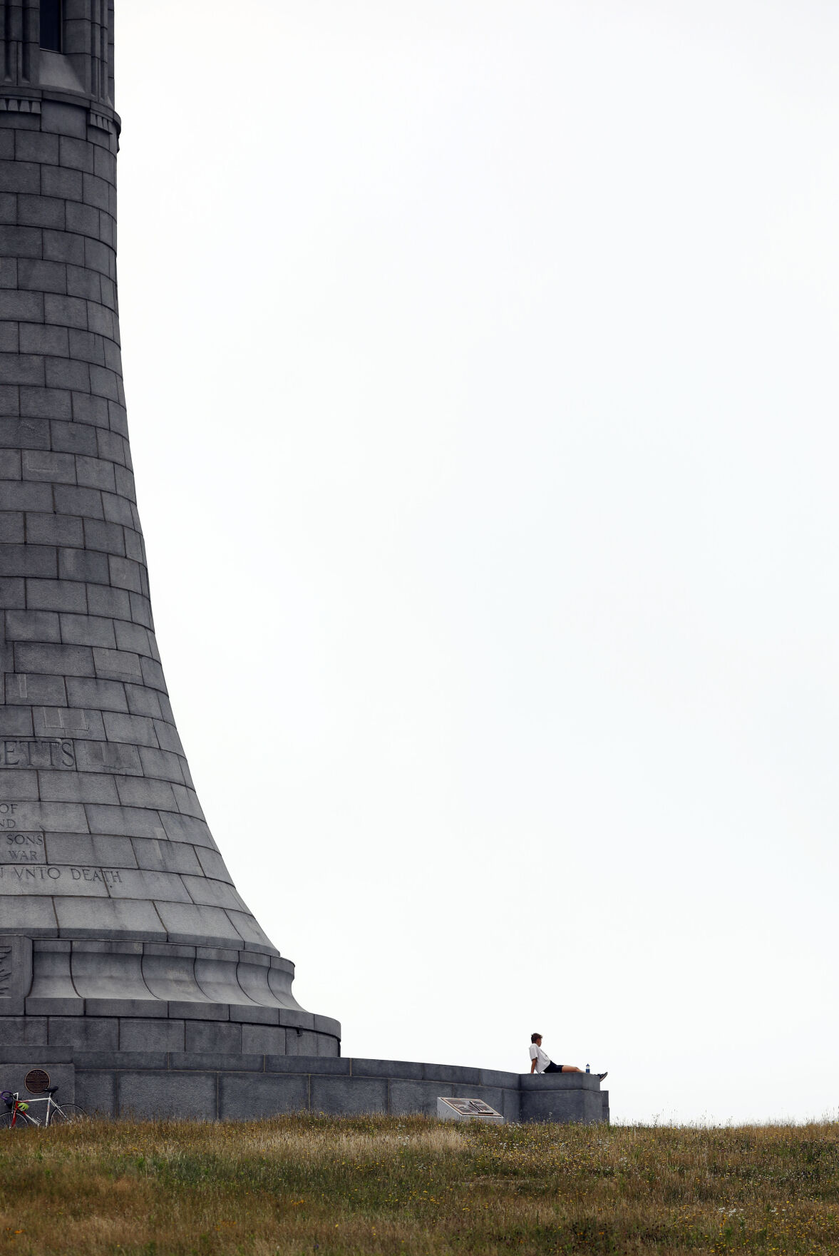 Olivia Oberle sits at Veterans War Memorial Tower on Mount Greylock